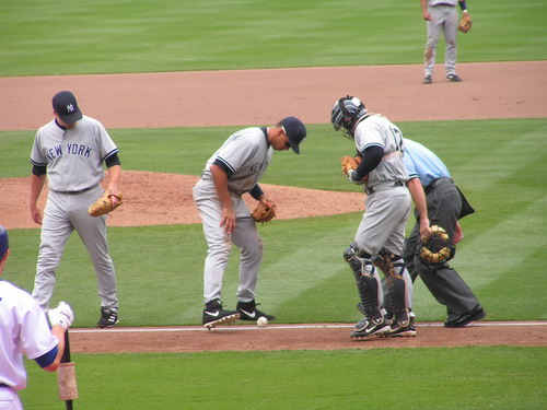 blue calls it fair as A Rodriguez, Derek Jeter, and Posada look on dodgers yankees 2004 Copyright  2004